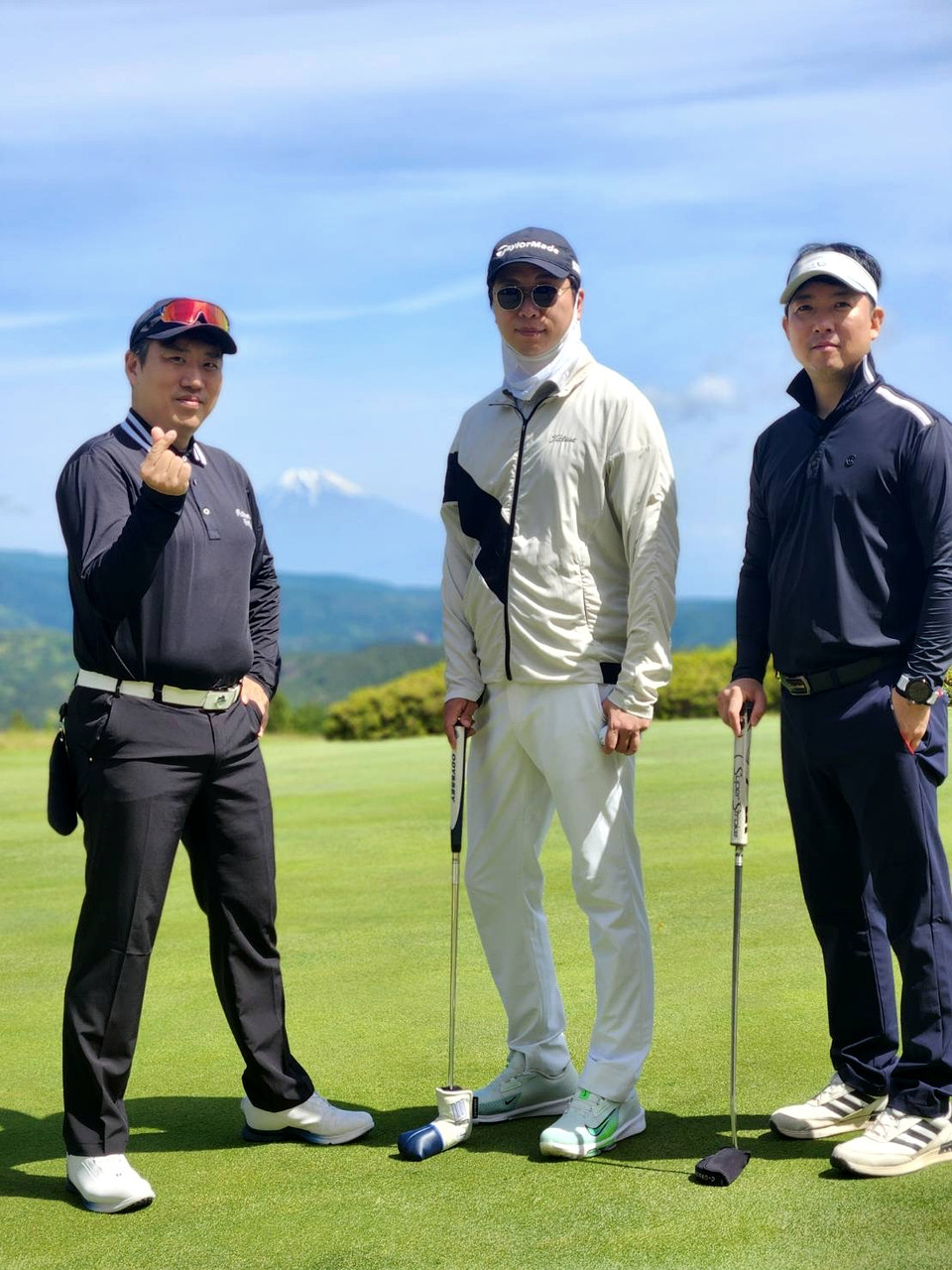 Participants posing together on the course during the tournament